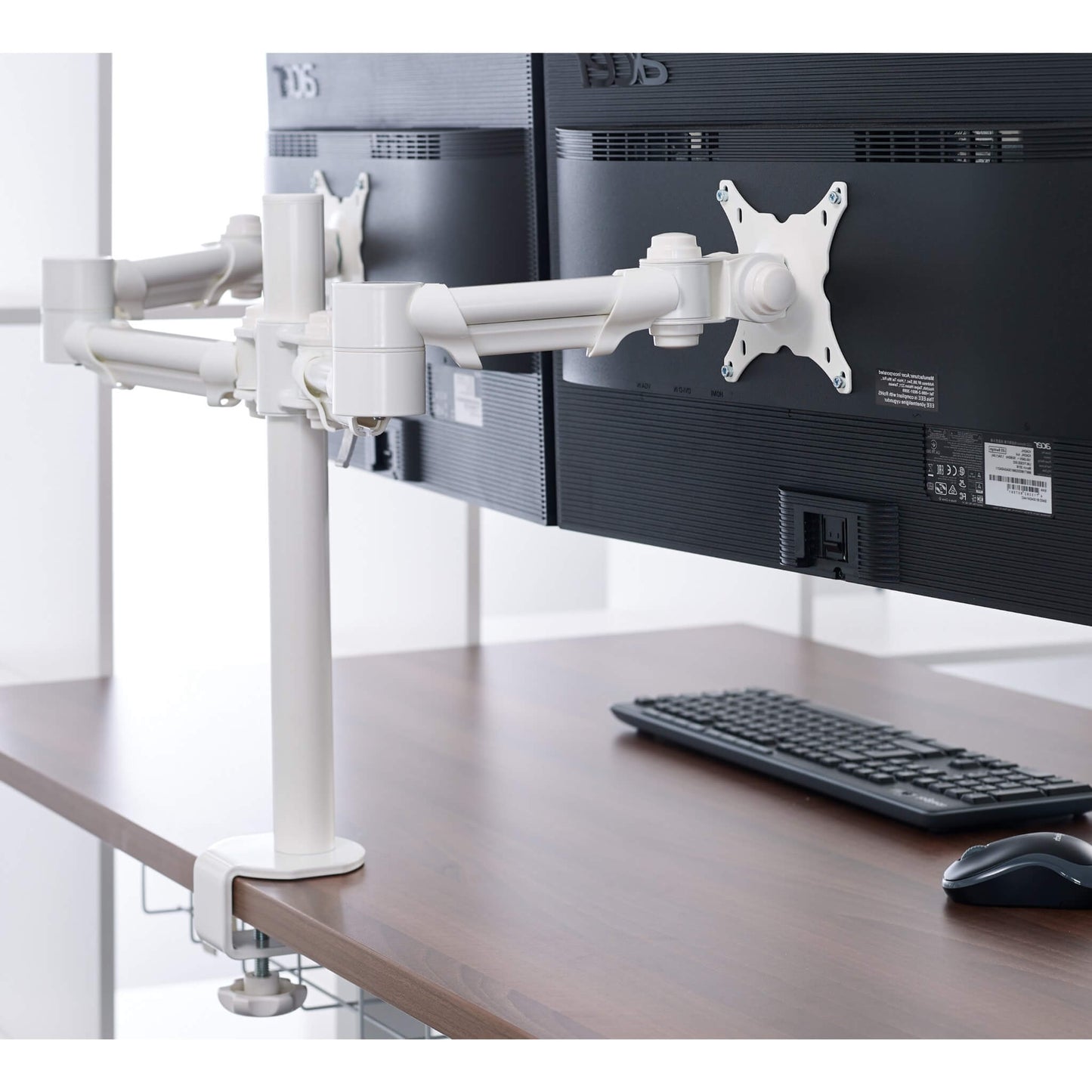 White double monitor arm for standing desks in use from Livewell Furniture at www.livewellfurniture.co.uk