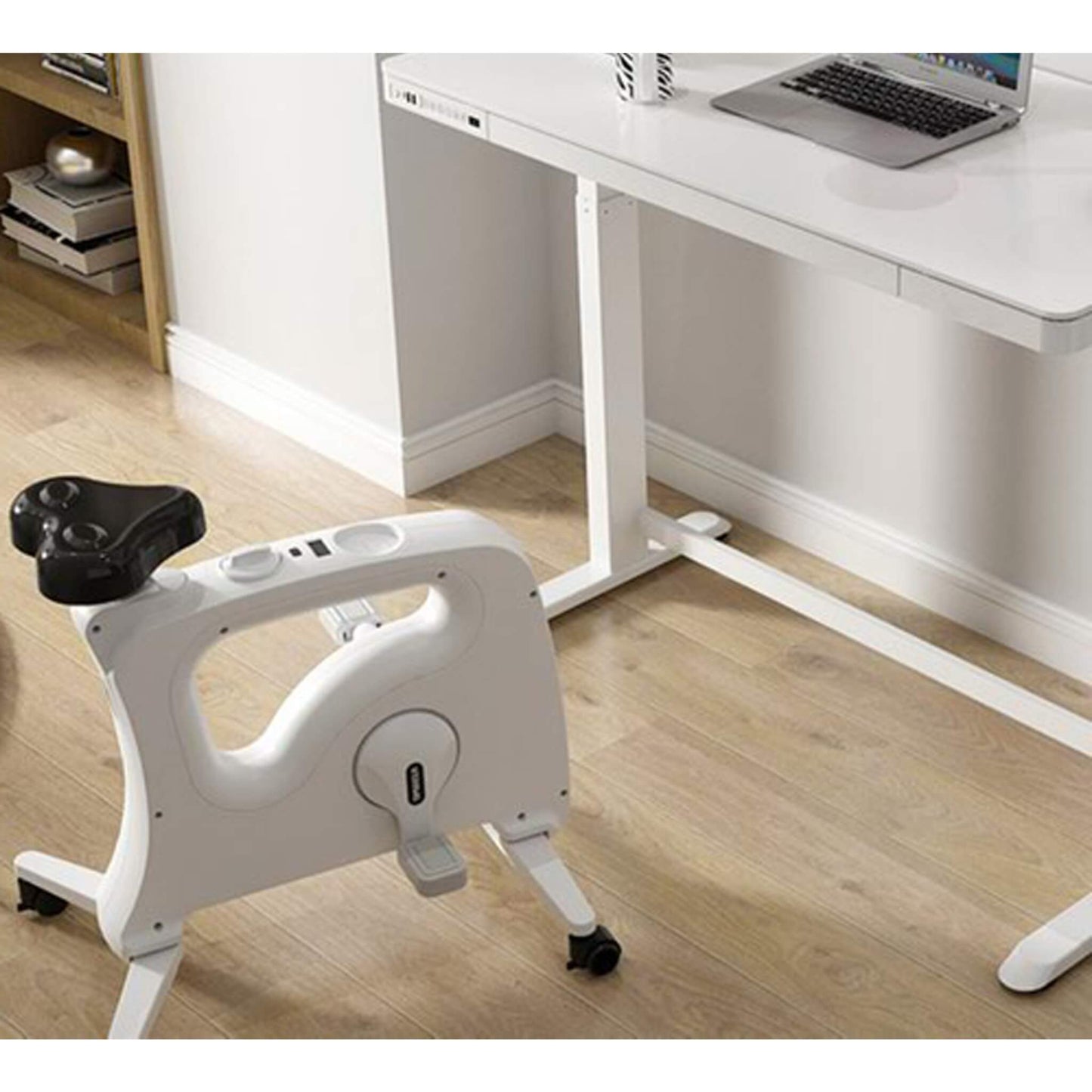 REVILO under-desk bike in white and in use from Livewell Furniture at www.livewellfurniture.co.uk